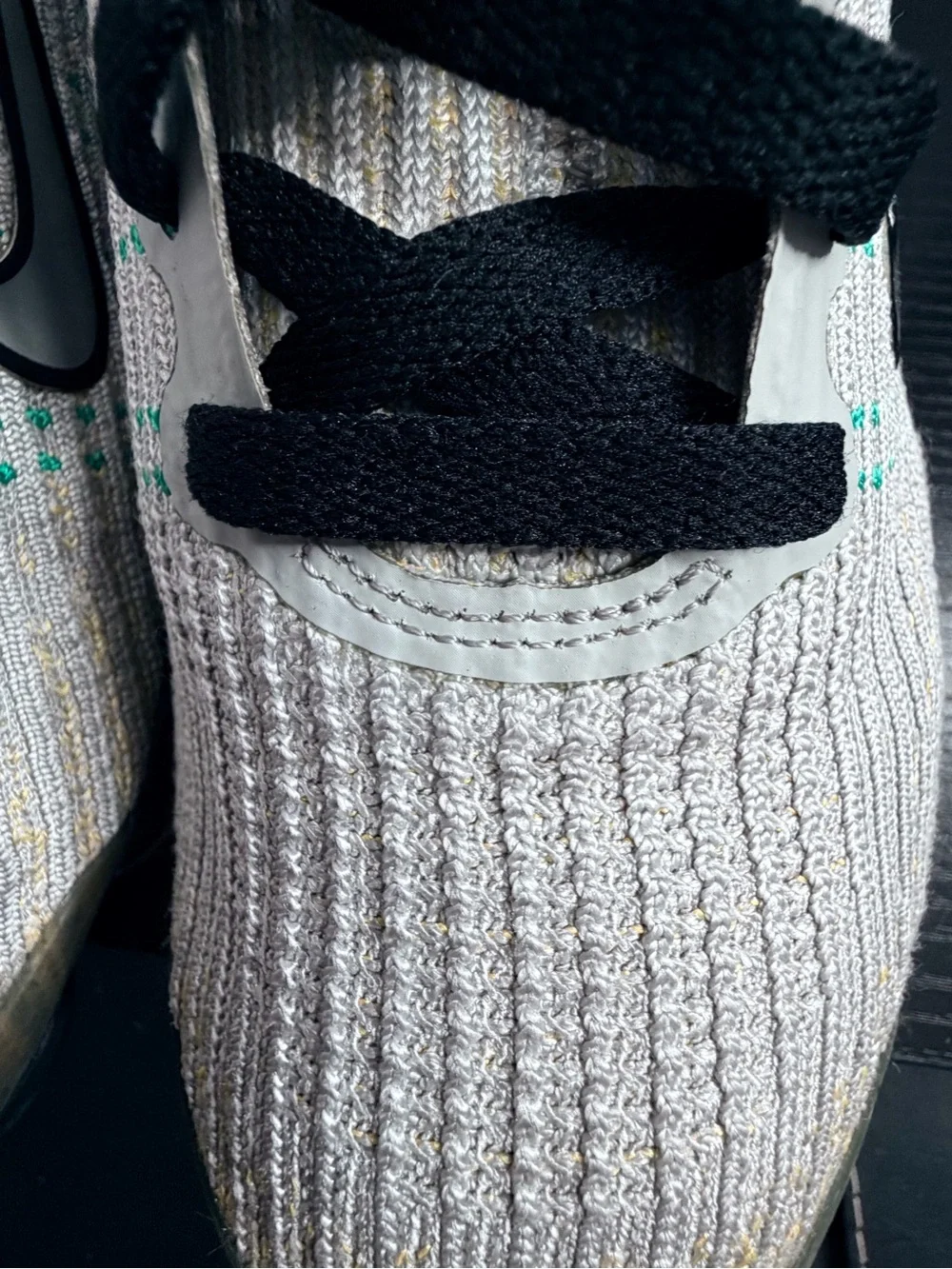 Nike Men’s White Knit Sneakers with Black Accents and Teal Dots